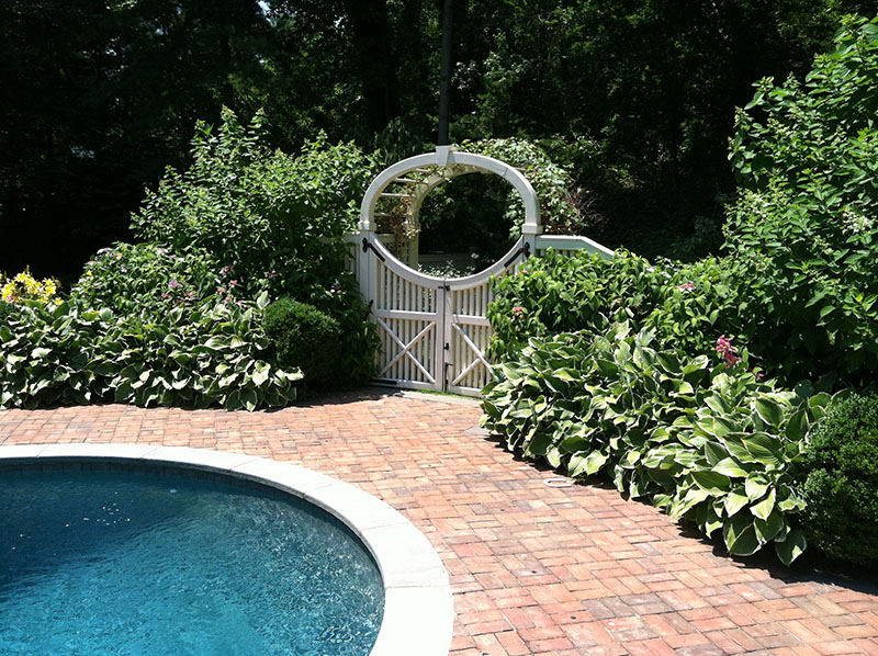 patio and white gate around pool