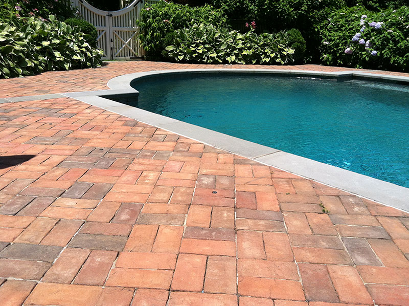 red brick patio around pool