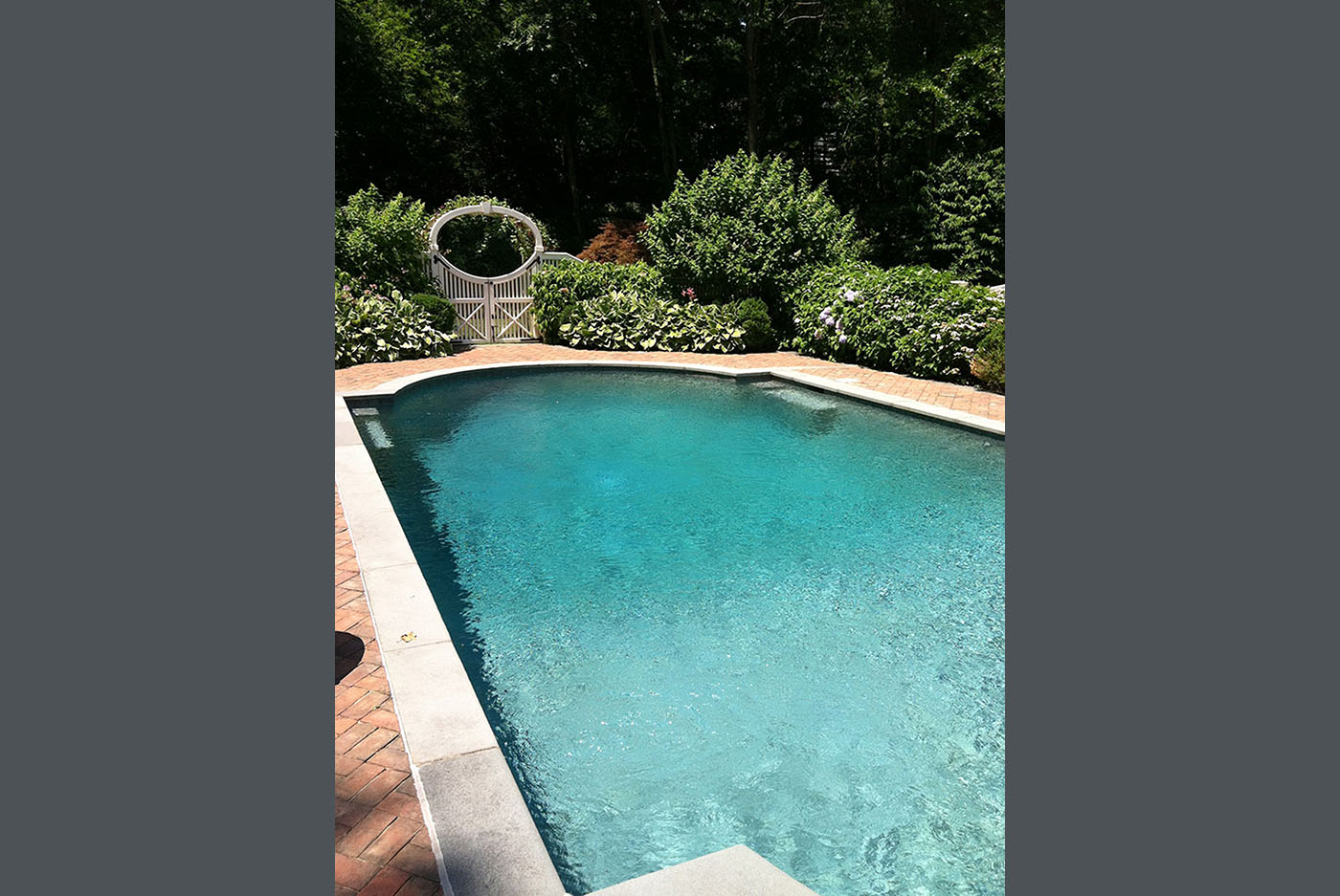 long swimming pool in backyard