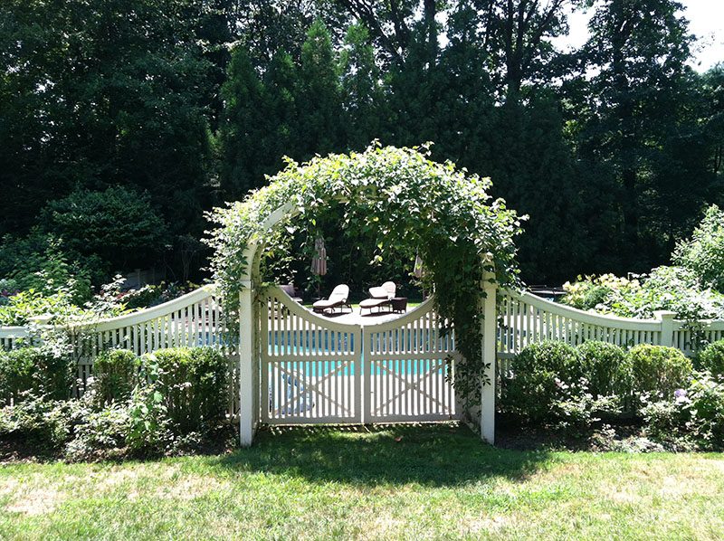 beautiful white gate and fence around pool