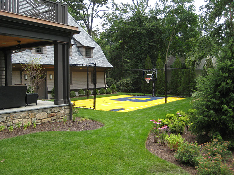 outdoor michigan style basketball court in backyard